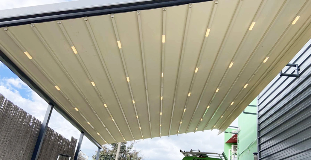 Réalisation de Pergola de 16 x 6 m à toile rétractable dans notre espace atelier à Cambaie